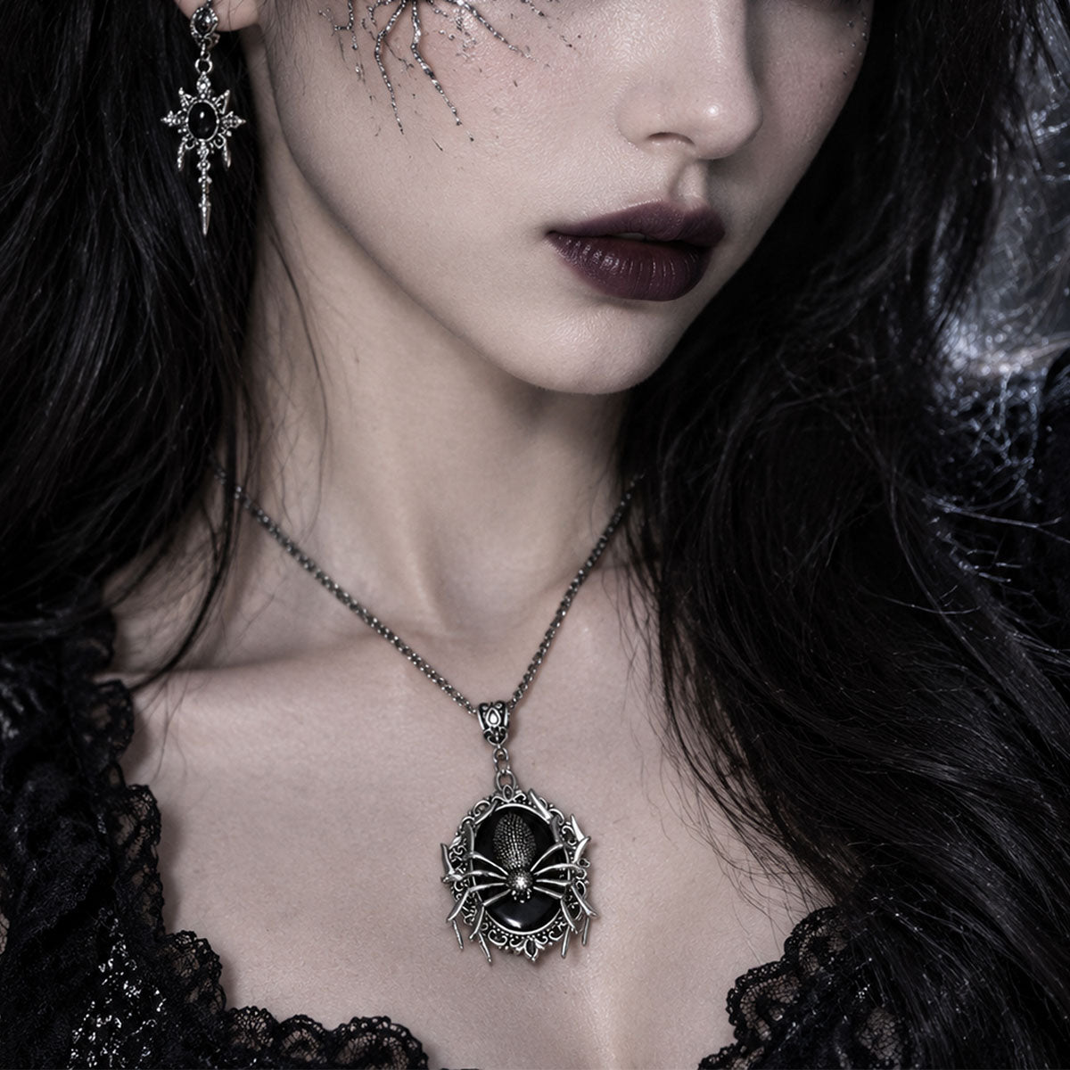 Woman wearing an ornate gothic spider pendant necklace