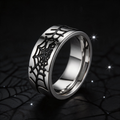 Spiderweb band ring worn with a black leather jacket