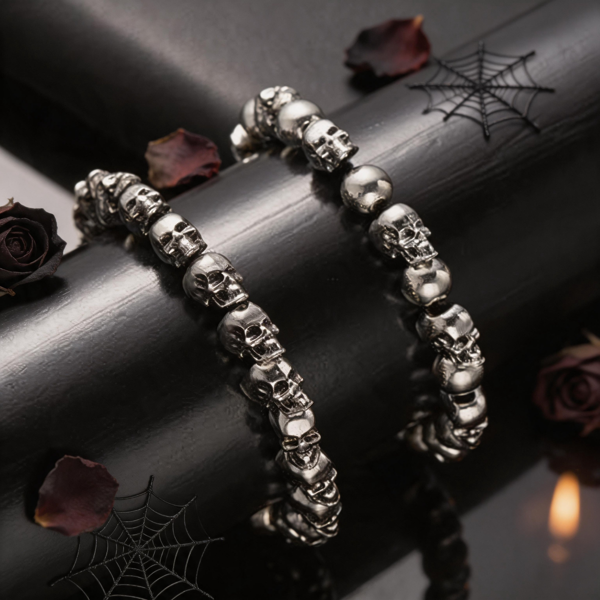 Man wearing a silver-tone skull bead bracelet with a black jacket