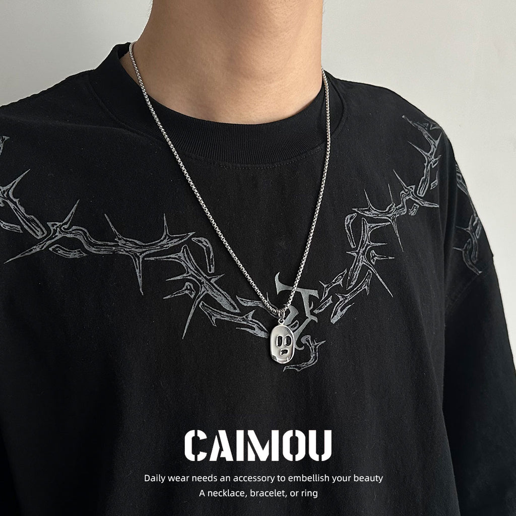 Ghost face pendant necklace worn with a black shirt
