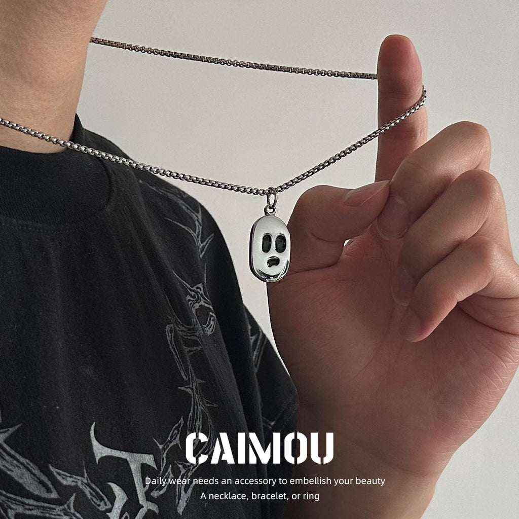 Long silver-tone ghost face necklace styling
